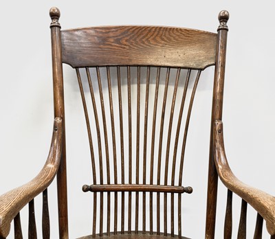 Lot 84 - A near pair of American oak armchairs, circa...