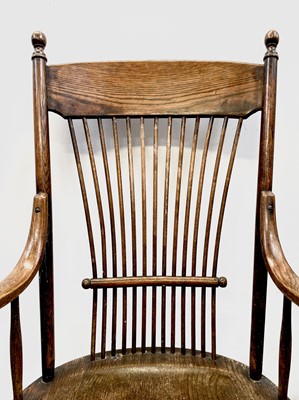Lot 84 - A near pair of American oak armchairs, circa...
