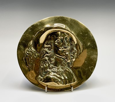 Lot 191 - A 19th century circular brass plaque depicting...