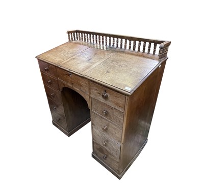 Lot 3107 - A late Victorian oak kneehole clerk's desk,...