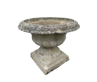 Lot 651 - A reconstituted stone urn. Height 45cm.