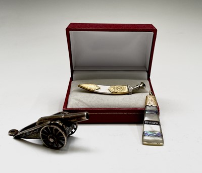 Lot 145 - A Chinese silver miniature model of a canon, a...