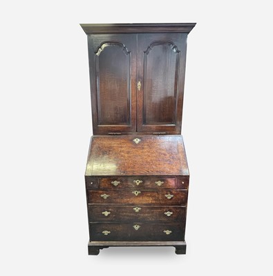 Lot 26 - A George III oak bureau bookcase, with a pair...