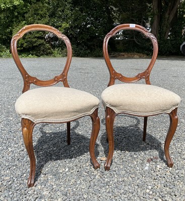Lot 3048 - Two Victorian walnut balloon back dining...