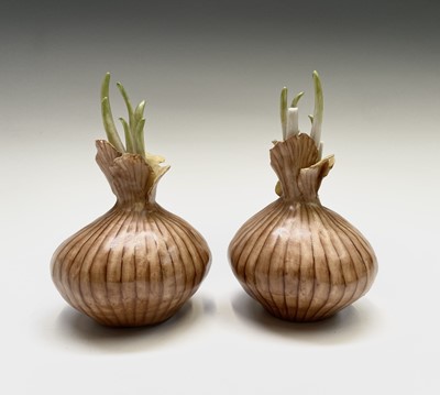 Lot 955 - Two porcelain onion sculptures modelled by...