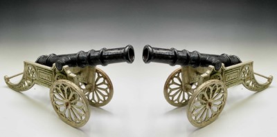 Lot 259 - A pair of decorative cast iron model cannon,...