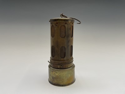 Lot 299 - A small brass and steel miners lamp, with...