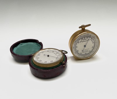 Lot 570 - A gilt cased pocket barometer, the silvered...