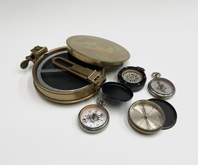 Lot 573 - A brass cased circular pocket compass,...