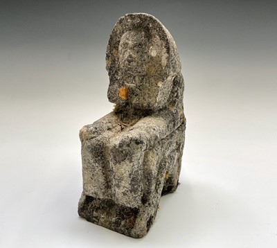 Lot 657 - A 20th century carved stone figure of a seated...