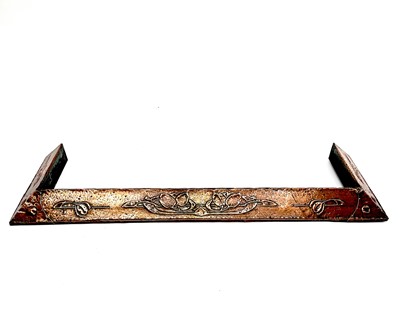 Lot 331 - An Arts and Crafts copper fender, embossed...