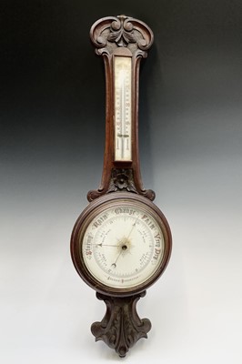 Lot 2930 - A late Victorian oak wheel barometer. Height...