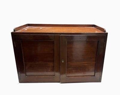 Lot 153 - A mahogany country house postage rack/cupboard,...