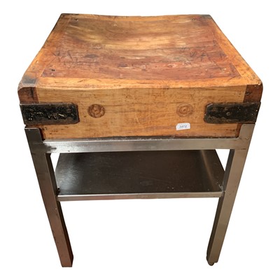 Lot 3290 - A butcher's block on metal stand, height 84cm,...