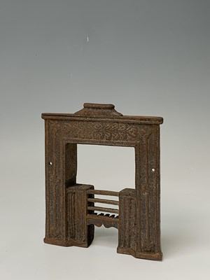 Lot 172 - A Victorian miniature cast iron fireplace,...