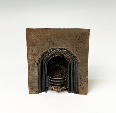 Lot 174 - A Victorian miniature cast iron fireplace,...