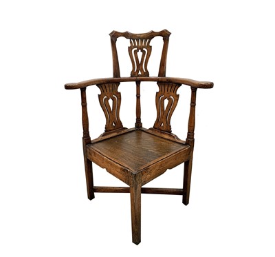 Lot 116 - A George III oak corner armchair, with...
