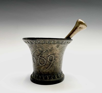 Lot 115 - A 17th century bronze pestle and mortar,...
