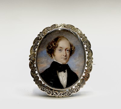 Lot 120 - A Victorian chased gold memoriam brooch set...