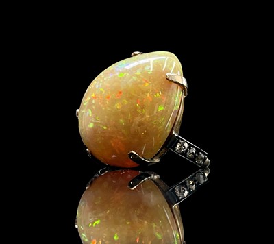 Lot 112 - An impressive opal ring with diamond set...