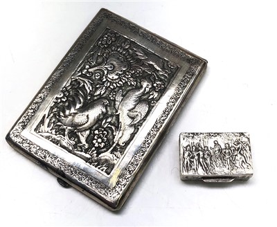 Lot 2025 - An Eastern silver cigarette case repousse...