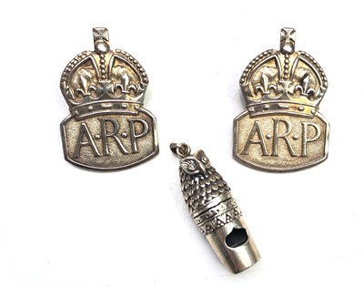 Lot 2044 - Two silver ARP badges together with a silver...