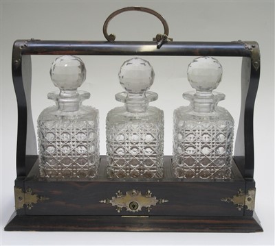 Lot 60 - An early 20th century coromandel tantalus with...