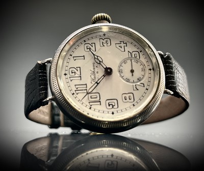 Lot 8 - A Waltham silver trench cased wristwatch the...