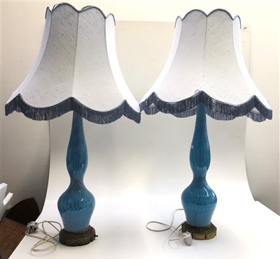 Lot 1019 - A pair of 20th century blue glass table lamps...