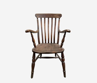 Lot 286 - A Victorian beech and elm lathe back armchair,...