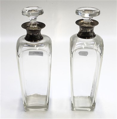 Lot 2036 - Two silver mounted glass decanters each of...