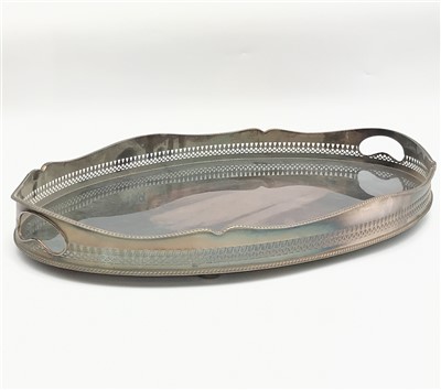 Lot 2302 - A large oval Georgian style tray, the pierced...