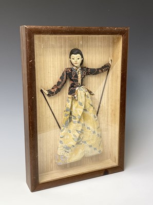 Lot 376 - An Indonesian doll, in a mahogany glazed...