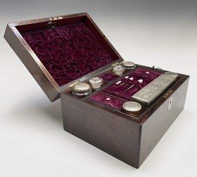 Lot 55 - A Victorian rosewood veneered toilet case with...
