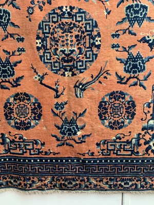 Lot 1252 - A Chinese rug, mid 19th century, the peach...
