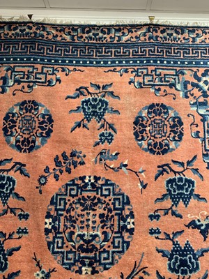 Lot 1252 - A Chinese rug, mid 19th century, the peach...