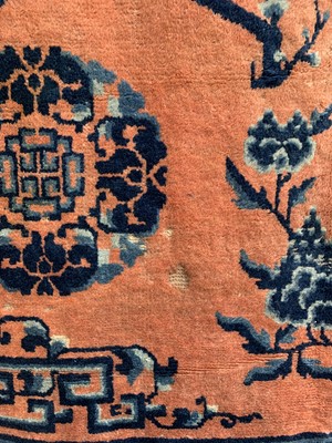 Lot 1252 - A Chinese rug, mid 19th century, the peach...