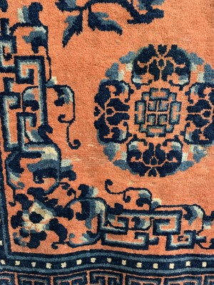 Lot 1252 - A Chinese rug, mid 19th century, the peach...