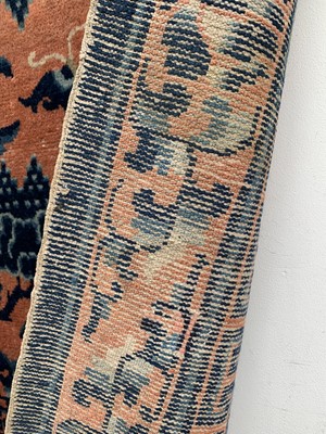 Lot 1252 - A Chinese rug, mid 19th century, the peach...
