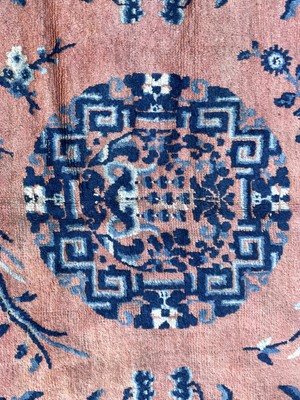 Lot 1252 - A Chinese rug, mid 19th century, the peach...