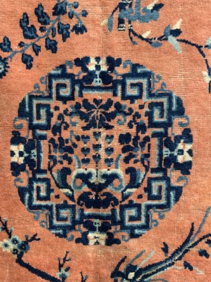Lot 1252 - A Chinese rug, mid 19th century, the peach...