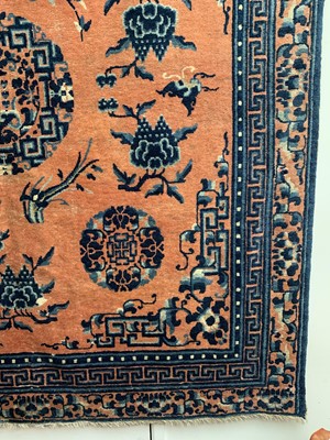 Lot 1252 - A Chinese rug, mid 19th century, the peach...