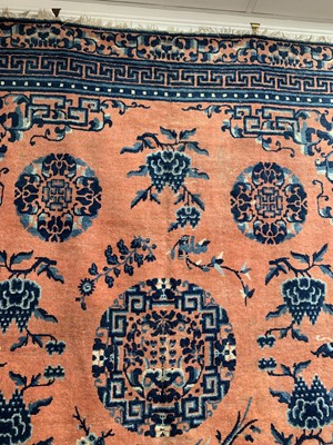 Lot 1252 - A Chinese rug, mid 19th century, the peach...