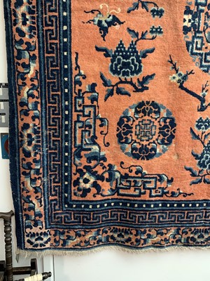 Lot 1252 - A Chinese rug, mid 19th century, the peach...