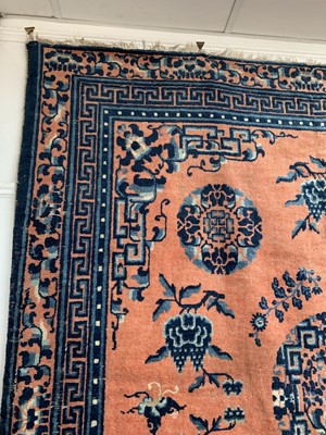 Lot 1252 - A Chinese rug, mid 19th century, the peach...