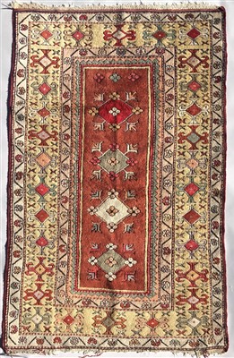 Lot 3103 - A Turkish Milas rug, the red field with four...