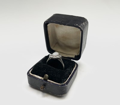 Lot 104 - An 18ct white gold and platinum, opal and...