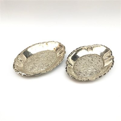 Lot 2128 - A pair of shaped repousse silver sweetmeat...