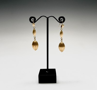 Lot 150 - A pair of contemporary 18ct gold matt earrings...