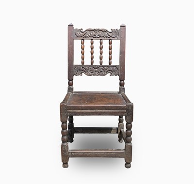 Lot 87 - A Charles II joined oak backstool,...
